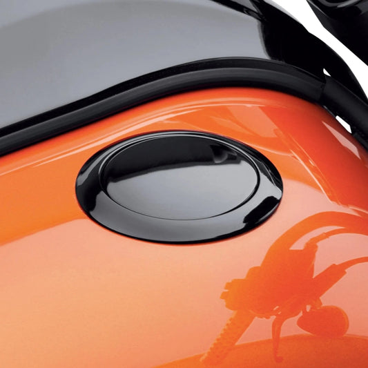 Close-up photograph of the Harley-Davidson Flush-Mount Fuel Cap in Black gloss on Orange Harley-Davidson tank. 61100007B.