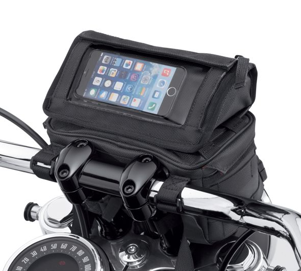 Harley-Davidson® Overwatch Large Handlebar Bag - 93300122.  The roomy Overwatch Large Handlebar Bag is the ultimate in style and practicality. This bag features a removable top compartment with a clear plastic touchscreen pouch that is perfect for holding your phone or GPS. The top pouch also has a zippered compartment that is perfect for storing your wallet and keys. The larger main compartment features one zip and one mesh pocket for organisation.